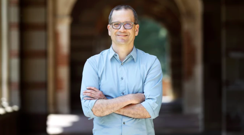 Chon Noriega in front of UCLA arches